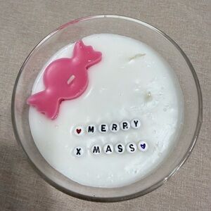 Festive Pink and White Holiday Candle